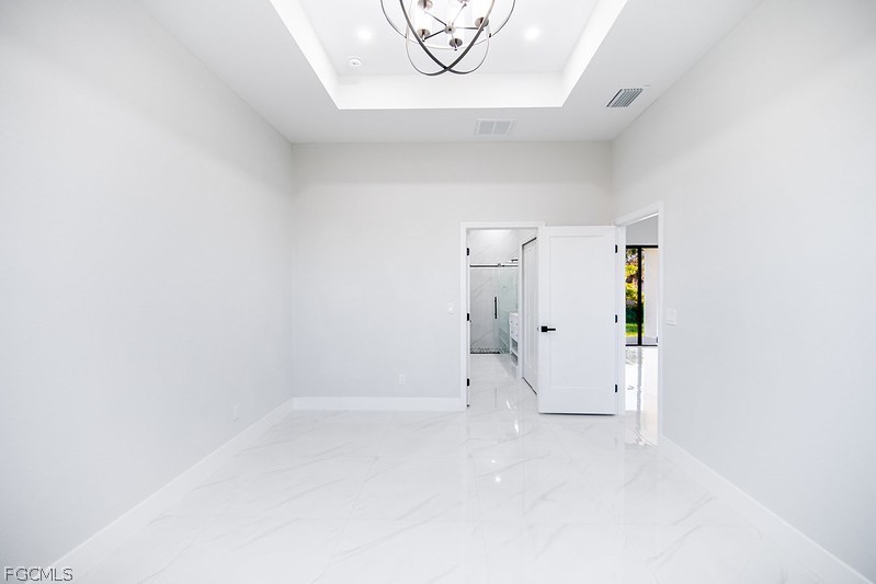 3313 36th Street Southwest Lehigh Acres, FL 33976 - Photo 14 of 27 a view of a room with white walls