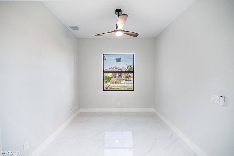 3313 36th Street Southwest Lehigh Acres, FL 33976 - Photo 18 of 27 an empty room with a window