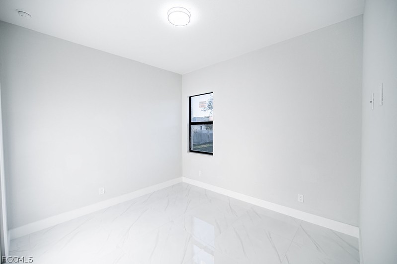 3313 36th Street Southwest Lehigh Acres, FL 33976 - Photo 19 of 27 a view of an empty room