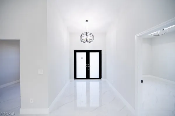 a view of a hallway with windows