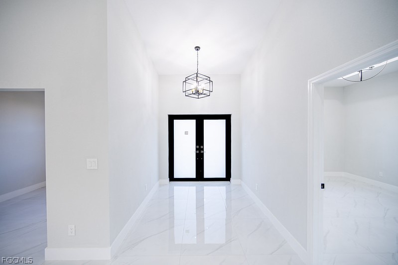 3313 36th Street Southwest Lehigh Acres, FL 33976 - Photo 21 of 27 a view of a hallway with windows