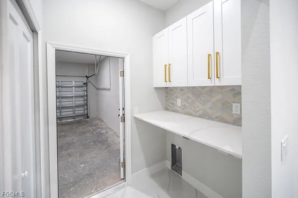a view of cabinet with washer and dryer