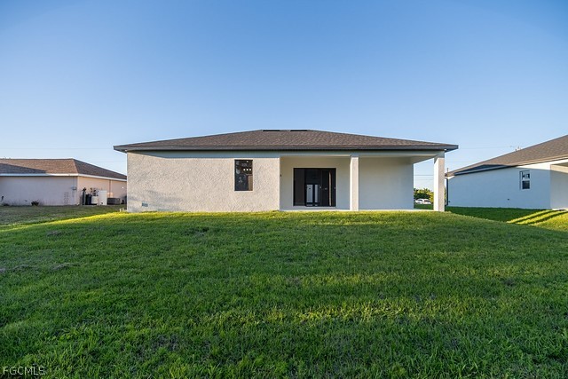 3313 36th Street Southwest Lehigh Acres, FL 33976 - Photo 26 of 27 a view of a house with backyard