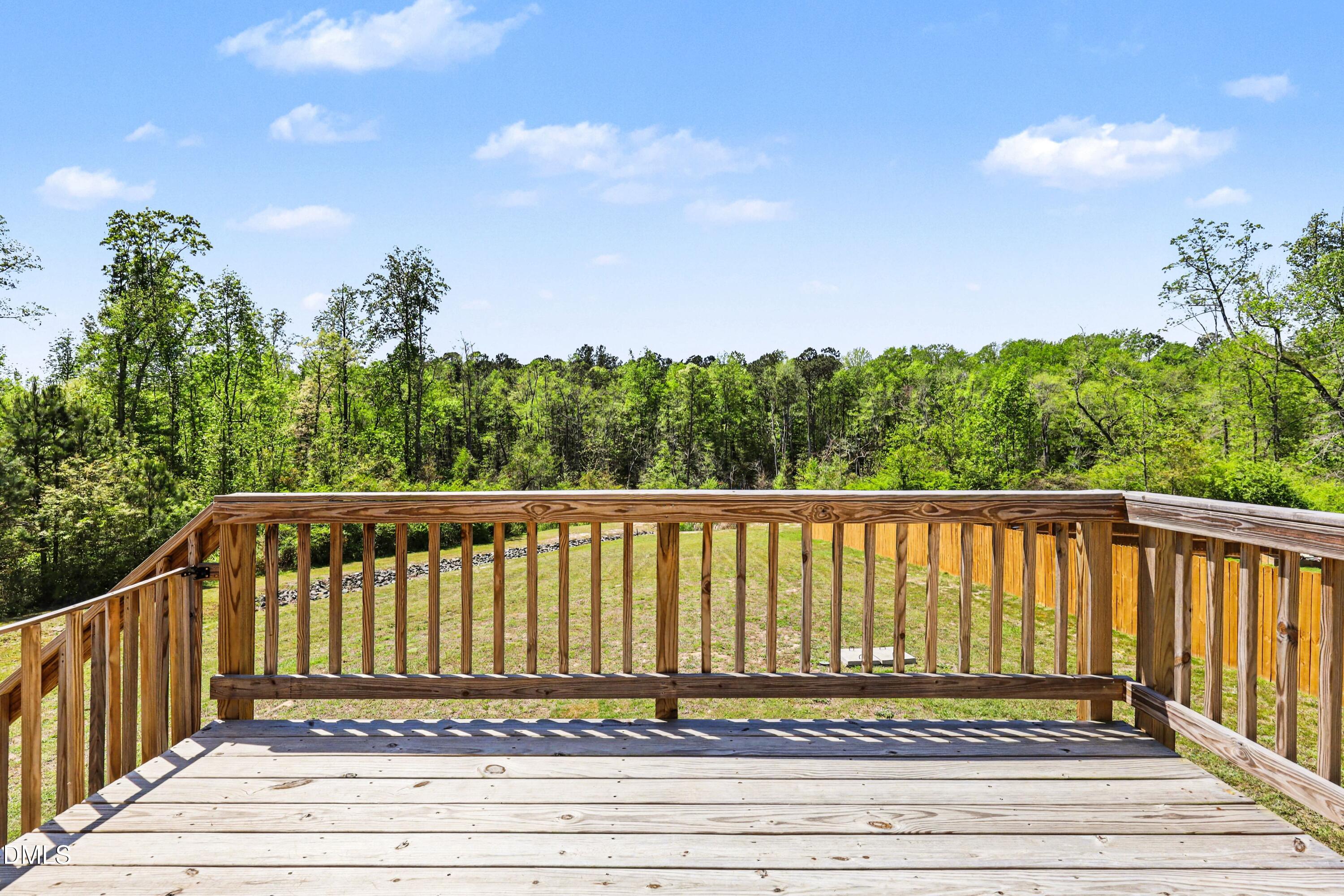 90 Rigsby Avenue Four Oaks, NC 27524 - Photo 35 of 43 a view of a wooden street from a balcony