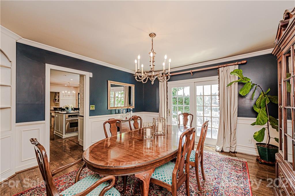 2831 Wickersham Road Charlotte, NC 28211 - Photo 13 of 47 a dining room with furniture a livingroom and chandelier