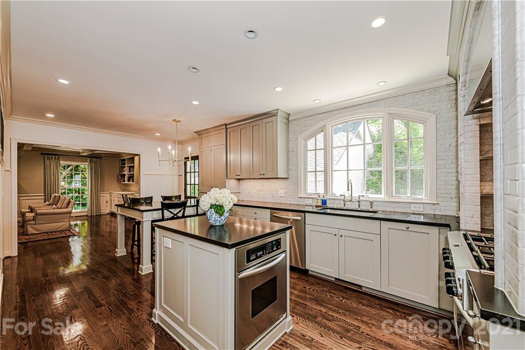 2831 Wickersham Road Charlotte, NC 28211 - Photo 14 of 47 a kitchen with a stove sink and refrigerator