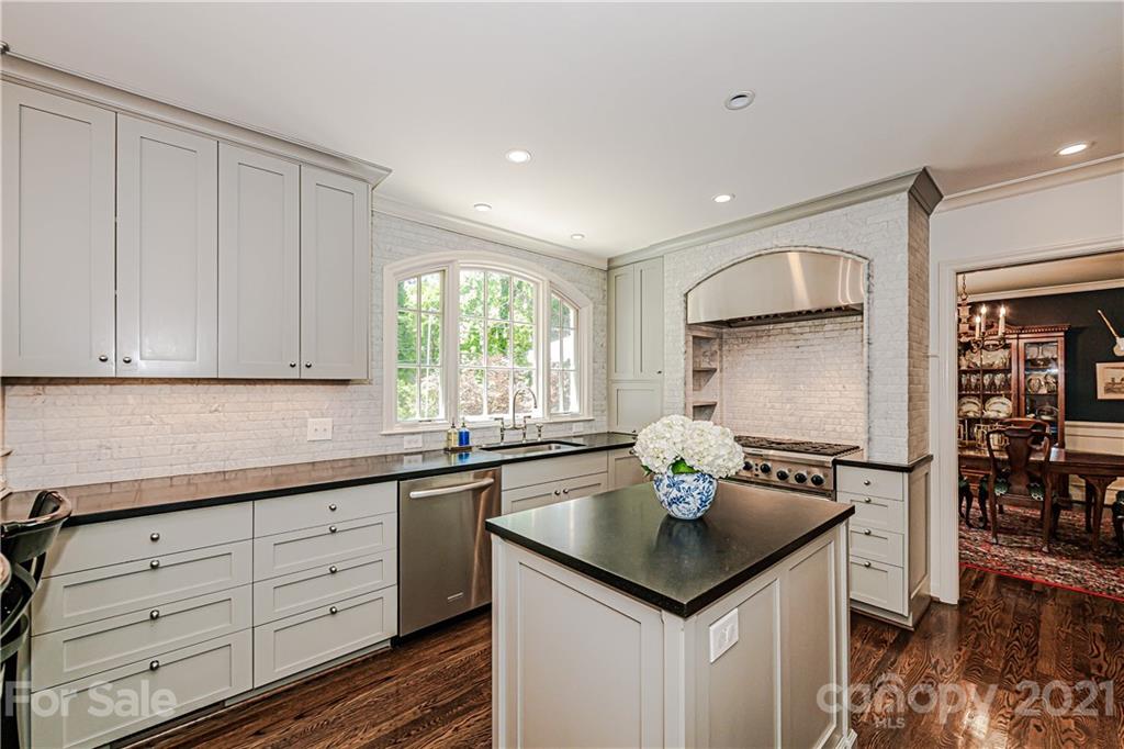 2831 Wickersham Road Charlotte, NC 28211 - Photo 16 of 47 a kitchen with appliances cabinets and furniture