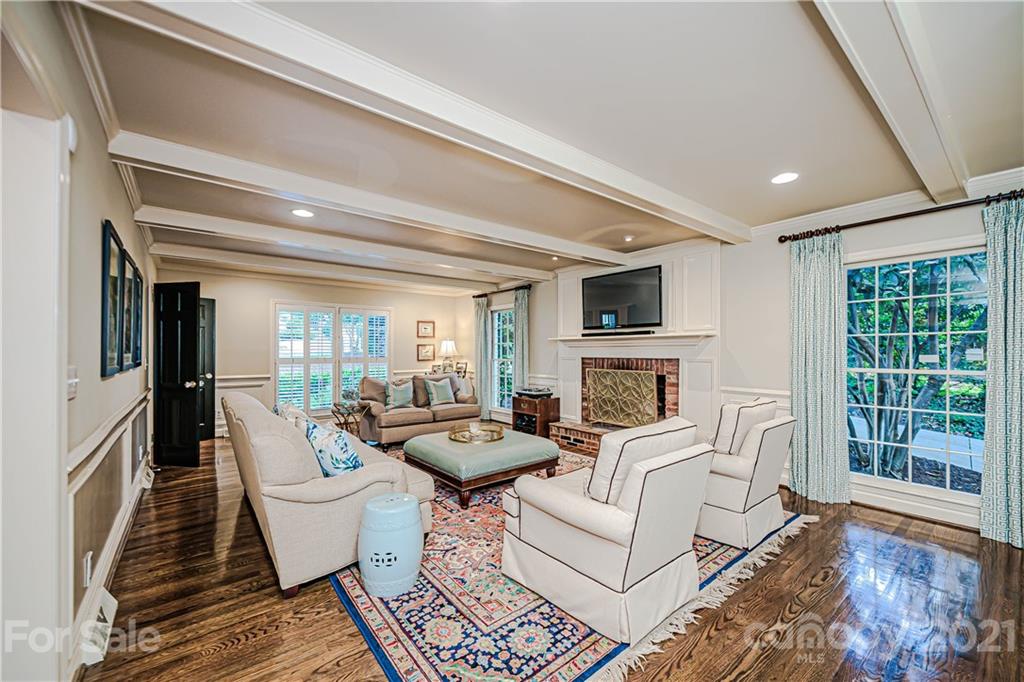 2831 Wickersham Road Charlotte, NC 28211 - Photo 23 of 47 a living room with fireplace furniture and a flat screen tv