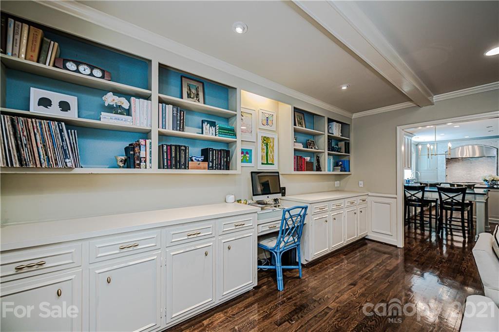 2831 Wickersham Road Charlotte, NC 28211 - Photo 26 of 47 a kitchen with stainless steel appliances white cabinets and wooden floor