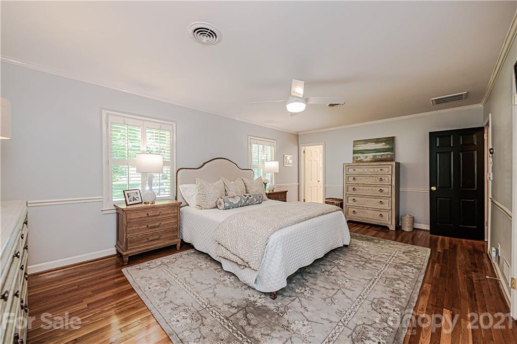 2831 Wickersham Road Charlotte, NC 28211 - Photo 31 of 47 a bedroom with a bed and a dresser