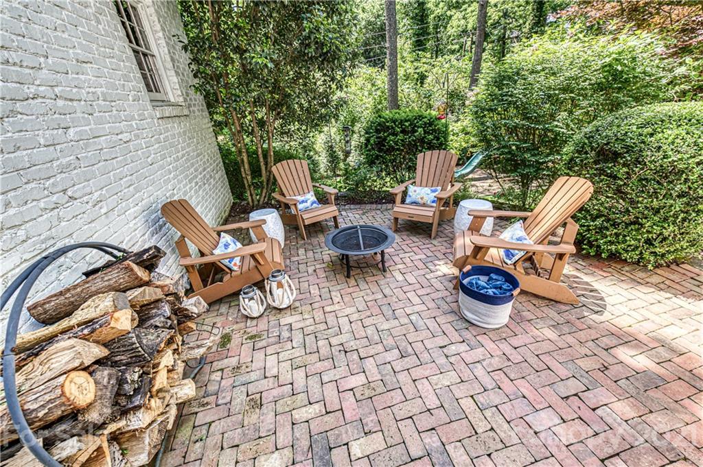 2831 Wickersham Road Charlotte, NC 28211 - Photo 40 of 47 a view of a lounge chair and tables in the patio