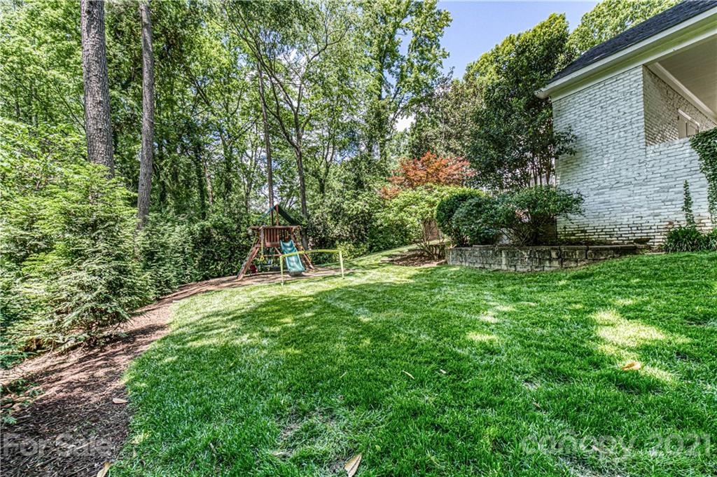 2831 Wickersham Road Charlotte, NC 28211 - Photo 42 of 47 a view of a backyard with a garden