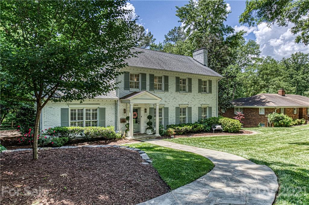 2831 Wickersham Road Charlotte, NC 28211 - Photo 46 of 47 a front view of a house with a garden