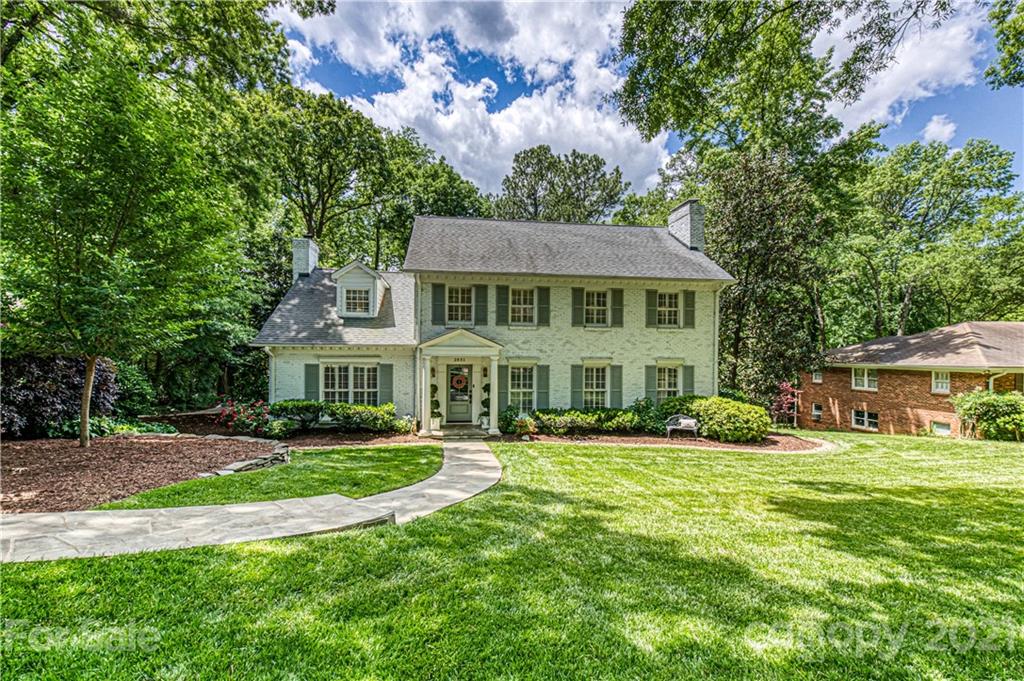 2831 Wickersham Road Charlotte, NC 28211 - Photo 47 of 47 a front view of a house with a garden
