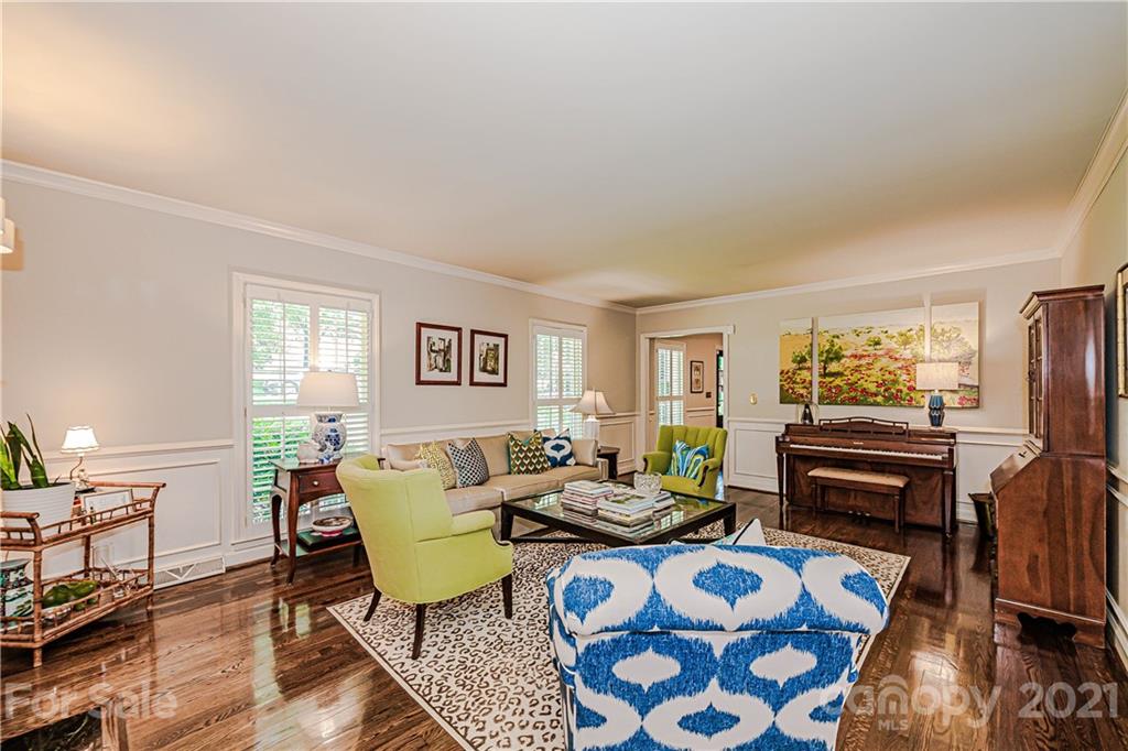 2831 Wickersham Road Charlotte, NC 28211 - Photo 8 of 47 a living room with furniture and a flat screen tv