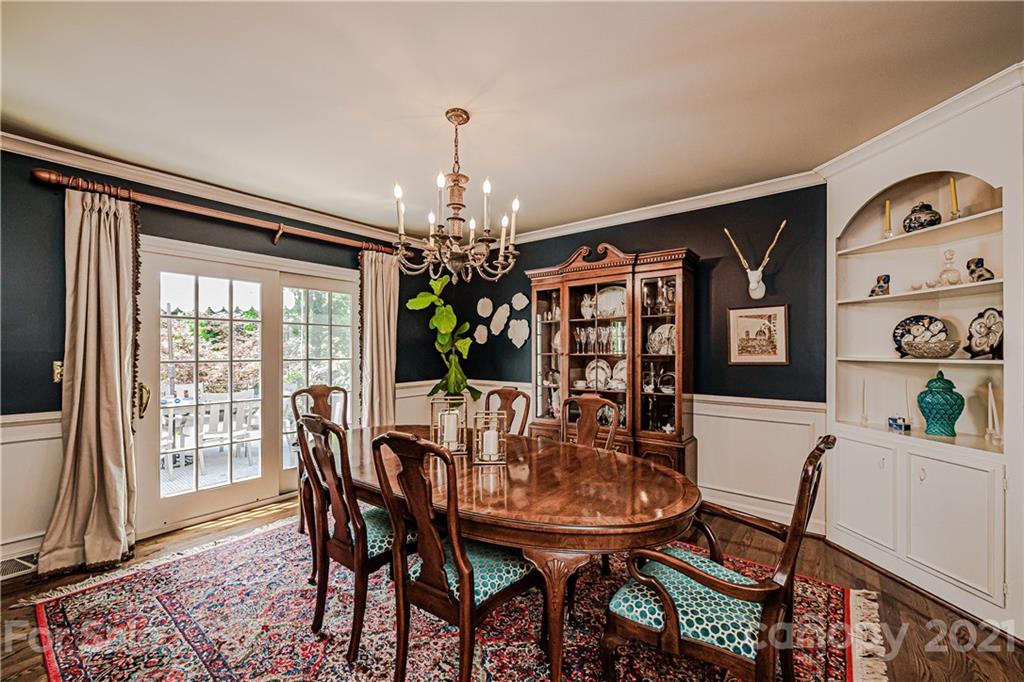 2831 Wickersham Road Charlotte, NC 28211 - Photo 10 of 47 a view of a dining room with furniture and a chandelier