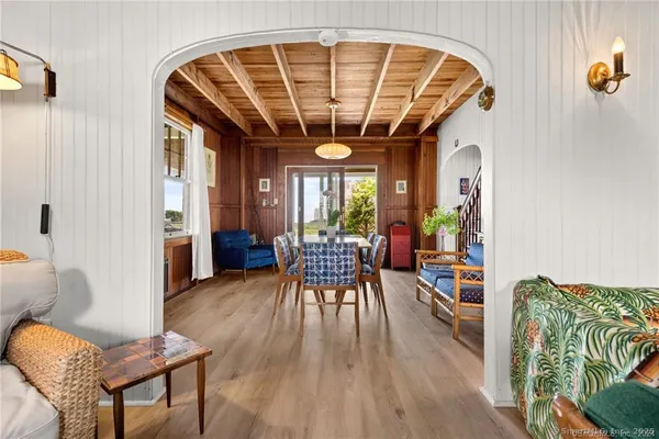 a front view of a house with a garden and porch