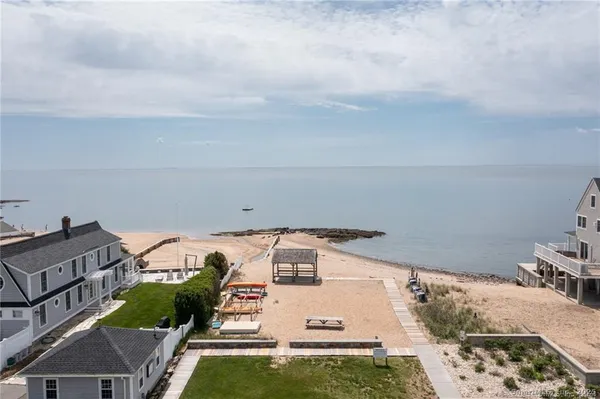a dining room with furniture a rug and a chandelier