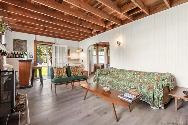 a bathroom with a sink a mirror and a shower