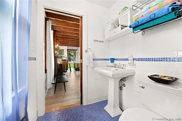 a bed room with a bed and a chair