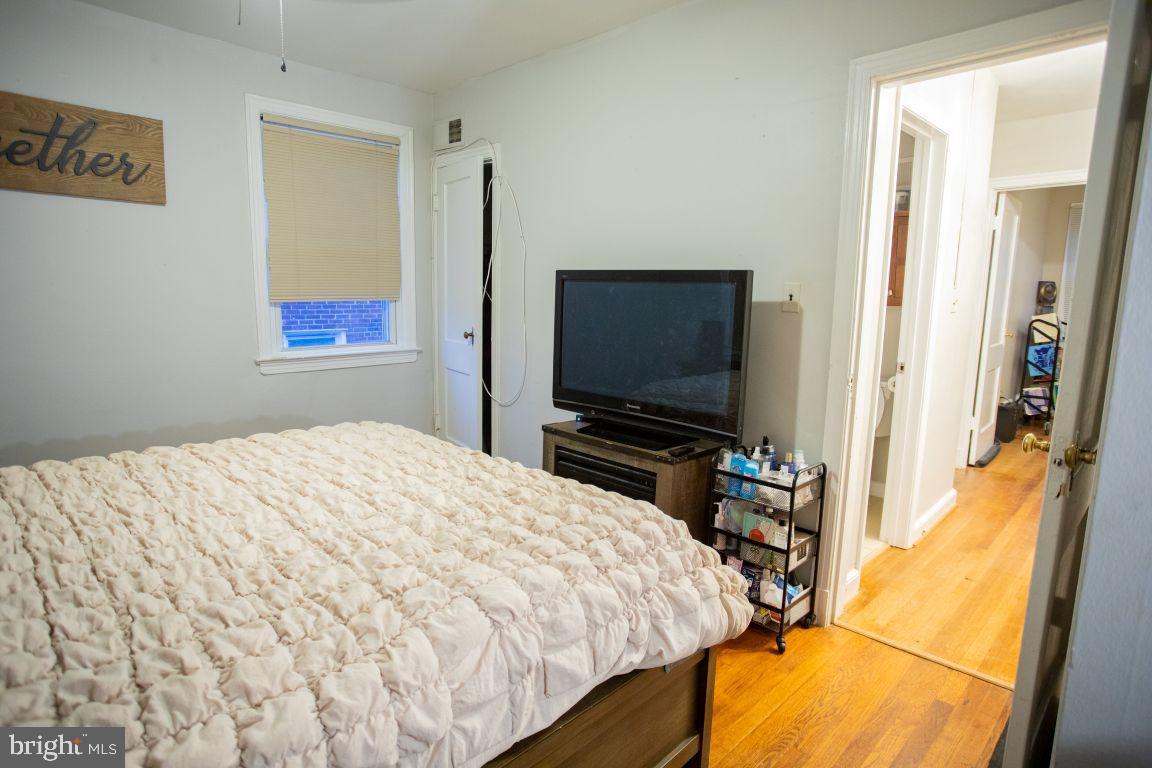 3913 Q Street Southeast Washington, DC 20020 - Photo 21 of 31 a bedroom with a bed and a flat screen tv