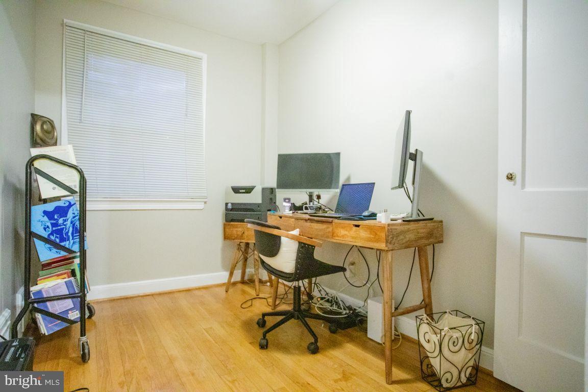 3913 Q Street Southeast Washington, DC 20020 - Photo 25 of 31 a view of a workspace with furniture and a gate