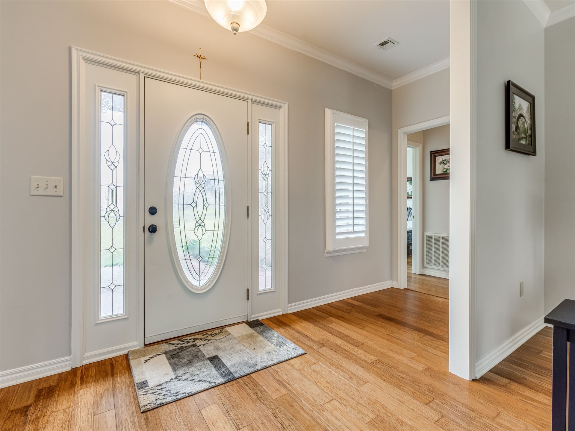 119 Mainsail Road Stigler, OK 74462 - Photo 5 of 52 Entryway featuring wood-finish flooring, a decorative glass front door, and a transom window