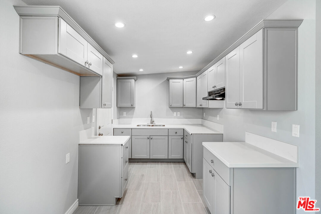 35233 Birch Road Barstow, CA 92311 - Photo 6 of 13 a kitchen with a sink a stove and cabinets