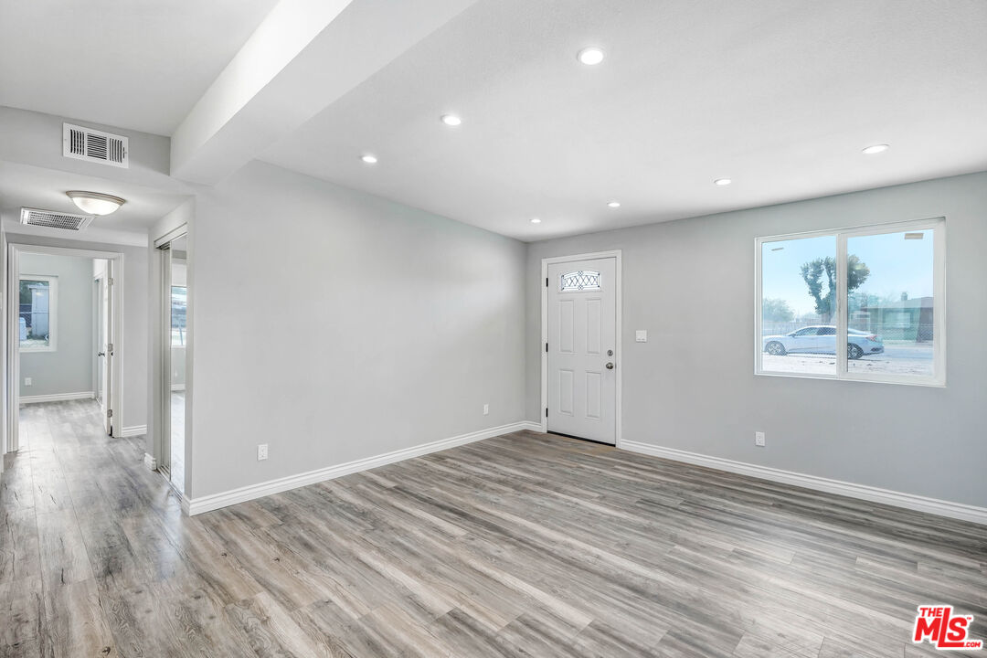 35233 Birch Road Barstow, CA 92311 - Photo 7 of 13 a view of empty room with wooden floor