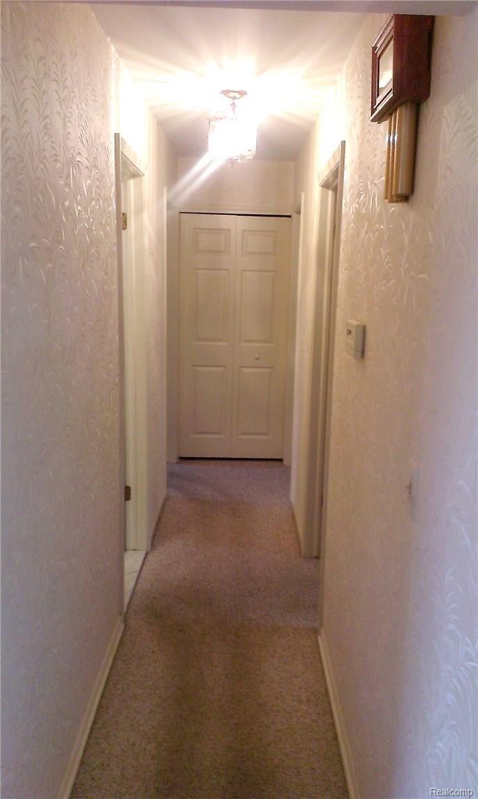 35800 Smithfield Road Farmington, MI 48335 - Photo 14 of 33 North-wing hallway leads to bedrooms and baths.