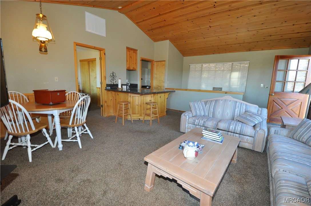 1419 Klamath Road Big Bear City, CA 92314 - Photo 11 of 31 a living room with furniture and a chandelier