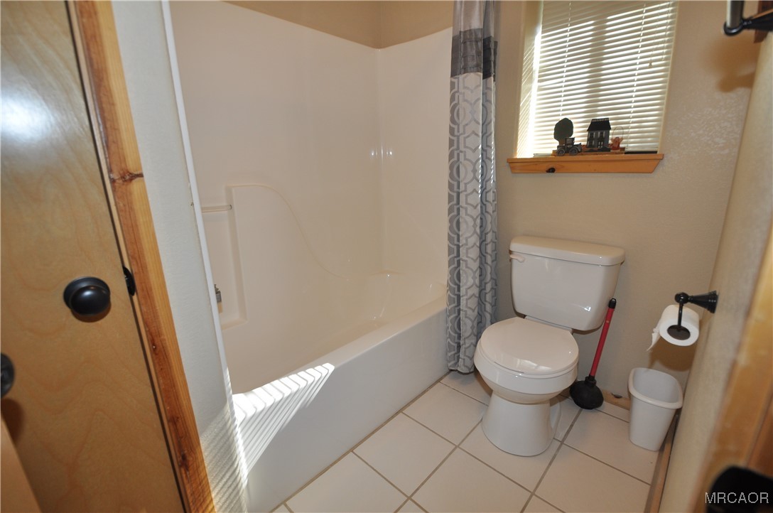 1419 Klamath Road Big Bear City, CA 92314 - Photo 28 of 31 a bathroom with a toilet and a shower