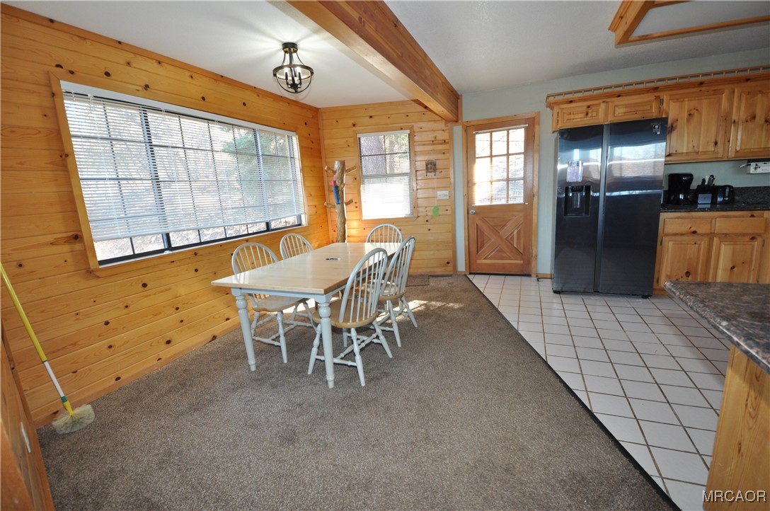 1419 Klamath Road Big Bear City, CA 92314 - Photo 4 of 31 a dining room with furniture and a chandelier