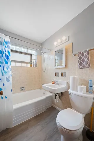 a bathroom with a sink toilet and a bathtub