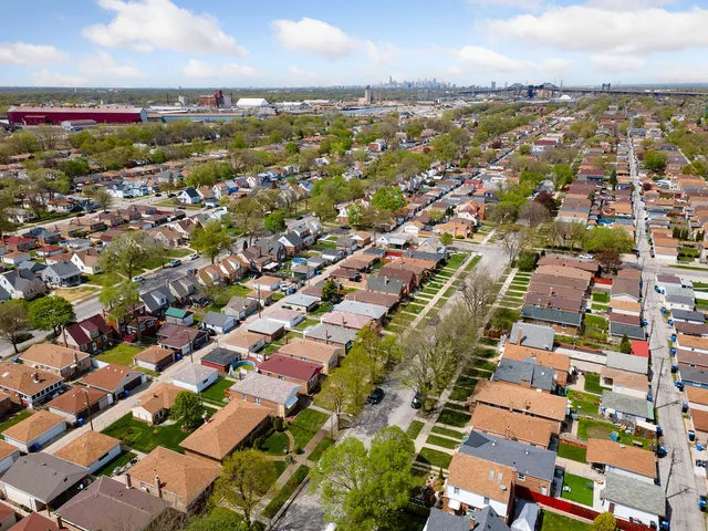 an aerial view of residential building with parking
