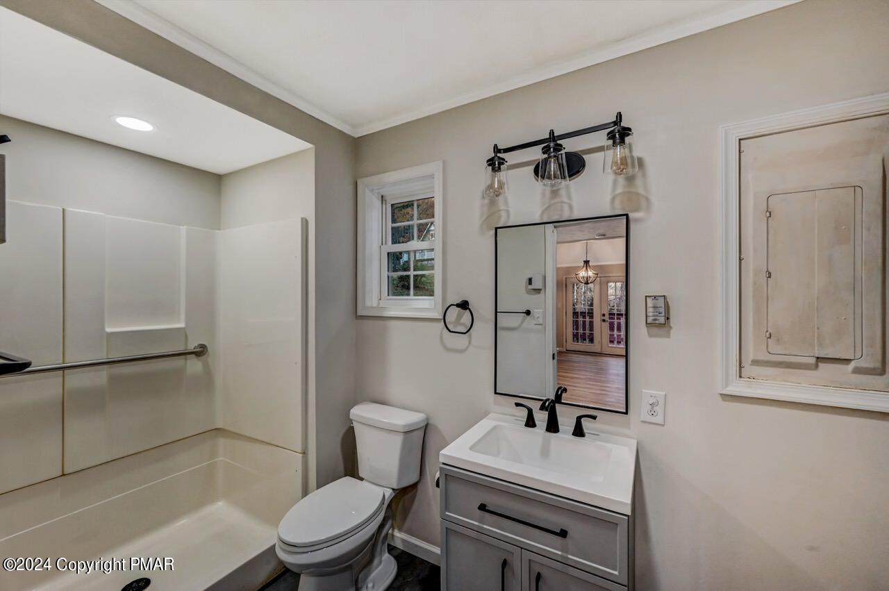 2228 Southport Drive Bushkill, PA 18324 - Photo 16 of 56 a bathroom with a sink toilet a mirror and shower