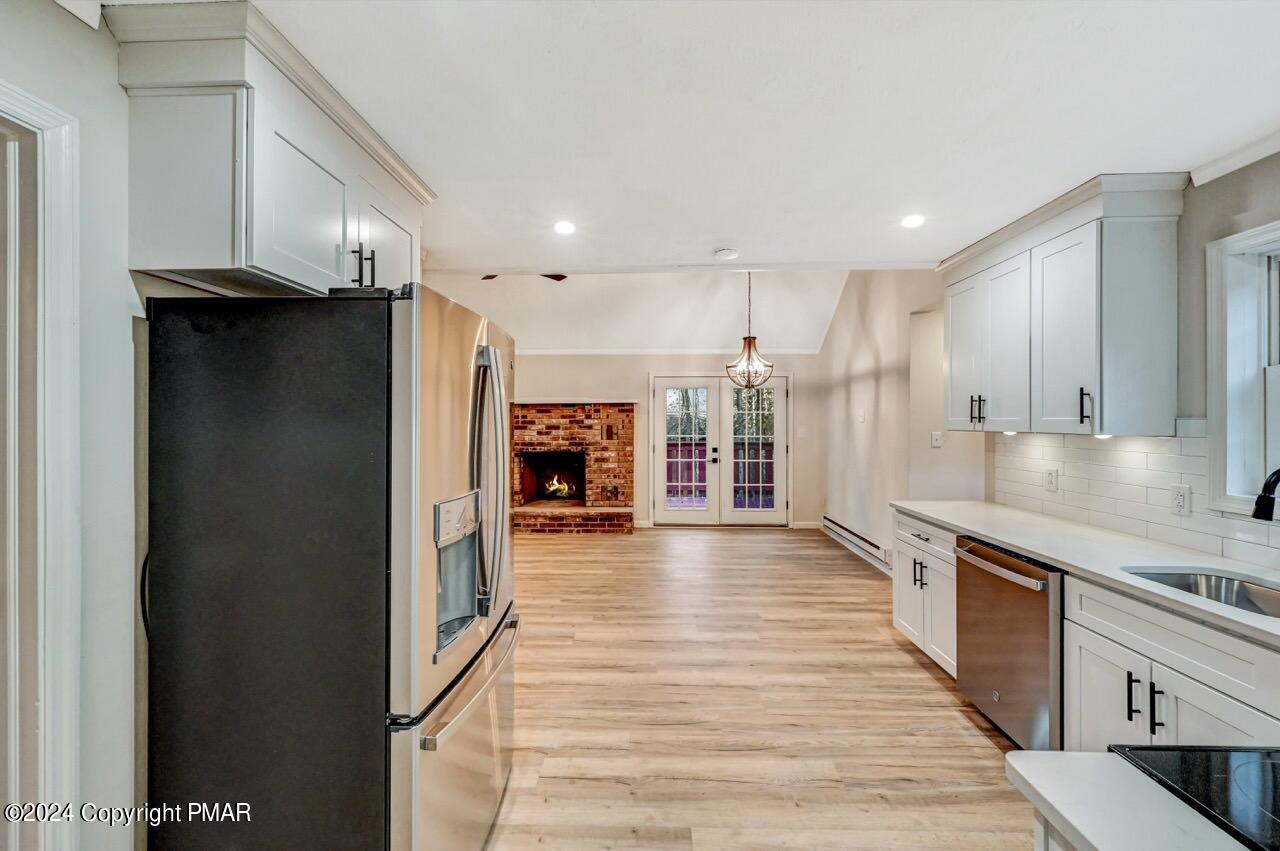 2228 Southport Drive Bushkill, PA 18324 - Photo 18 of 56 a kitchen with stainless steel appliances a refrigerator and a stove top oven