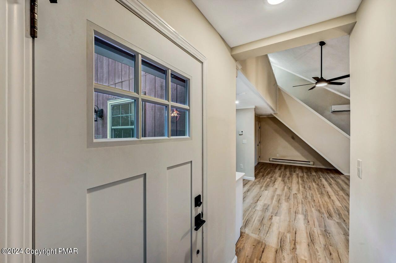 2228 Southport Drive Bushkill, PA 18324 - Photo 27 of 56 a view of balcony with wooden floor and stairs