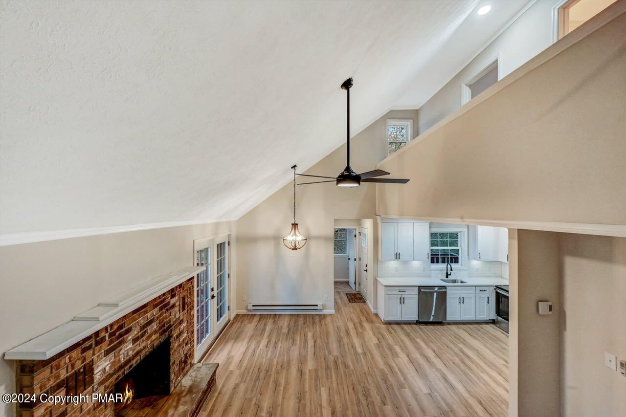 2228 Southport Drive Bushkill, PA 18324 - Photo 29 of 56 a view of a kitchen with a sink wooden floor and staircase