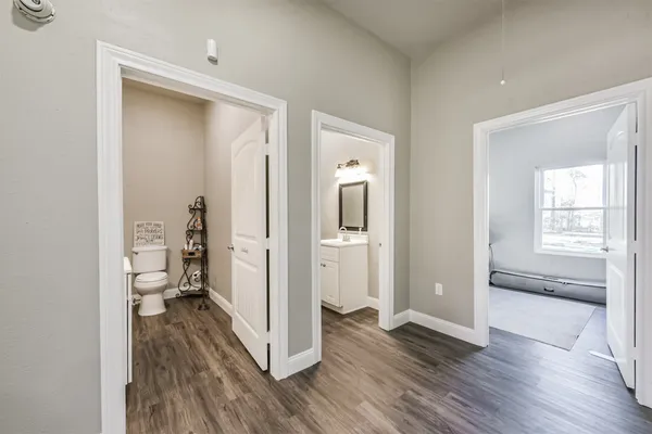 a view of a hardwood floor and a bedroom