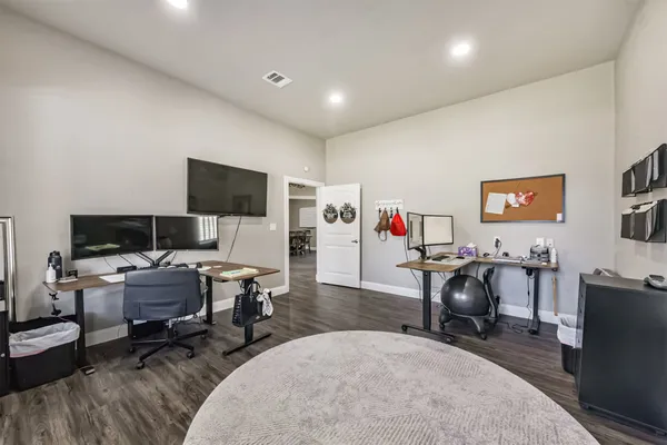 a livingroom with workspace and a couch