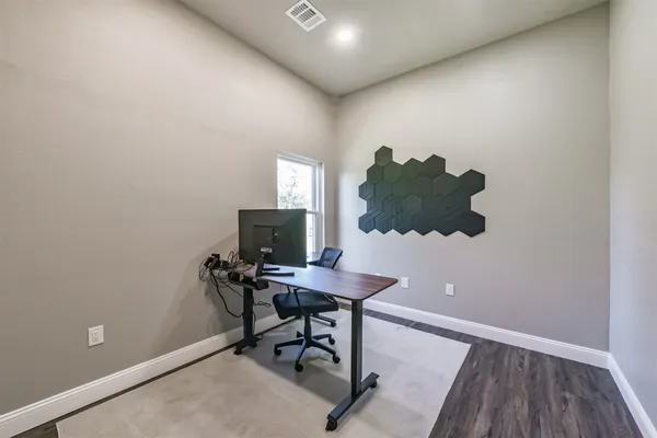 a workspace with furniture and wooden floor