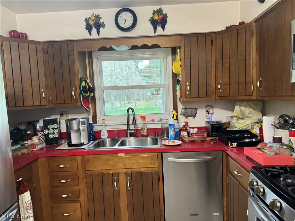 5320 North Ridge Road West Ashtabula, OH 44004 - Photo 2 of 33 Kitchen featuring sink and dishwasher