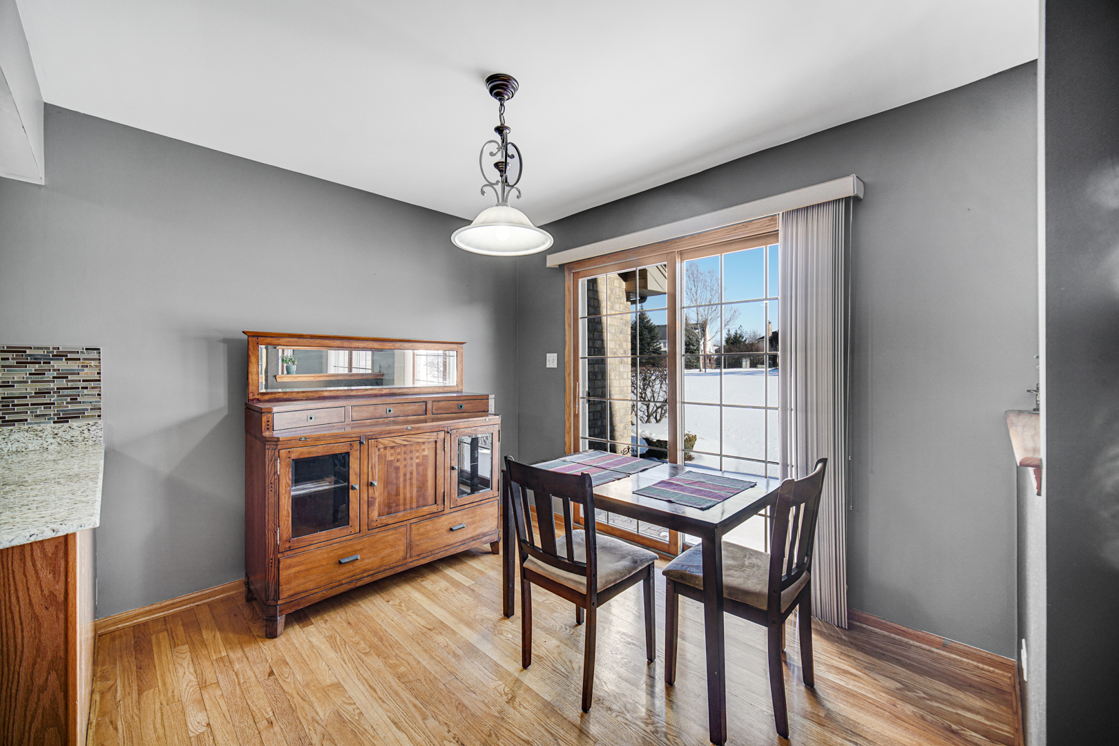 11837 Somerset Road Orland Park, IL 60467 - Photo 13 of 26 a view of a dining room with furniture window and wooden floor