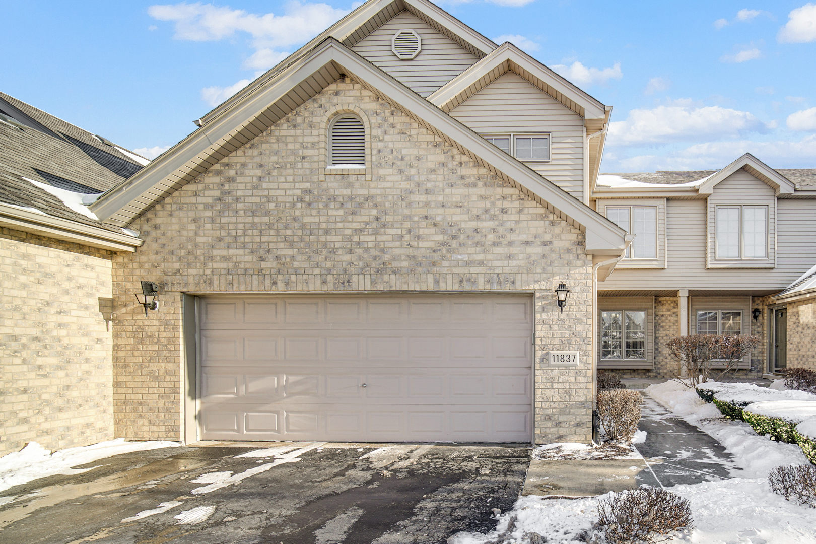 11837 Somerset Road Orland Park, IL 60467 - Photo 2 of 26 a view of a brick house with large windows