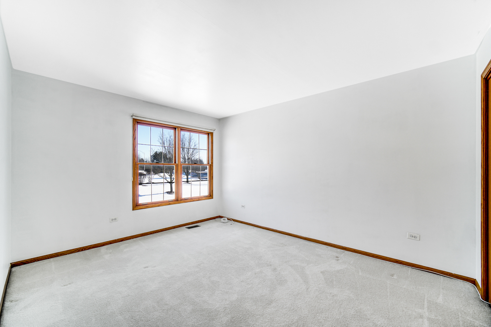11837 Somerset Road Orland Park, IL 60467 - Photo 21 of 26 an empty room with a window