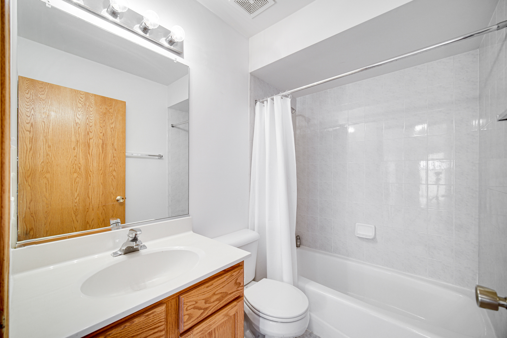 11837 Somerset Road Orland Park, IL 60467 - Photo 23 of 26 a bathroom with a sink toilet and shower