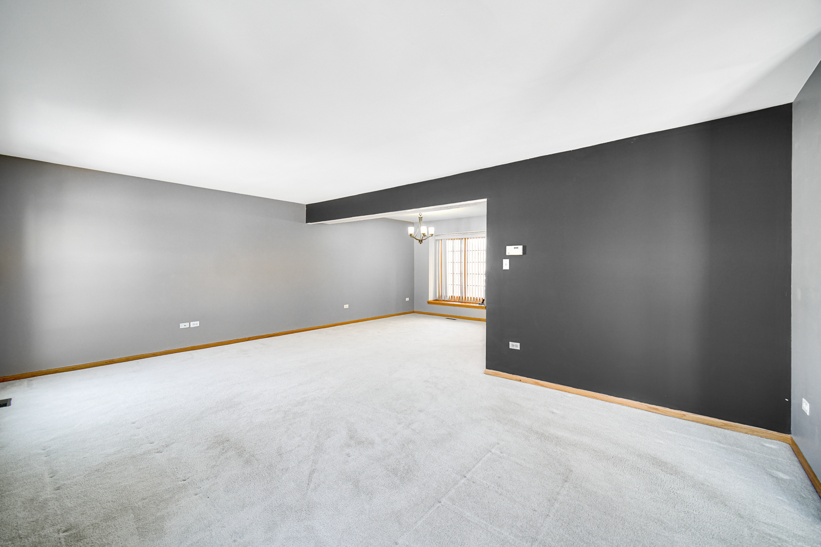 11837 Somerset Road Orland Park, IL 60467 - Photo 7 of 26 a view of an empty room with a window