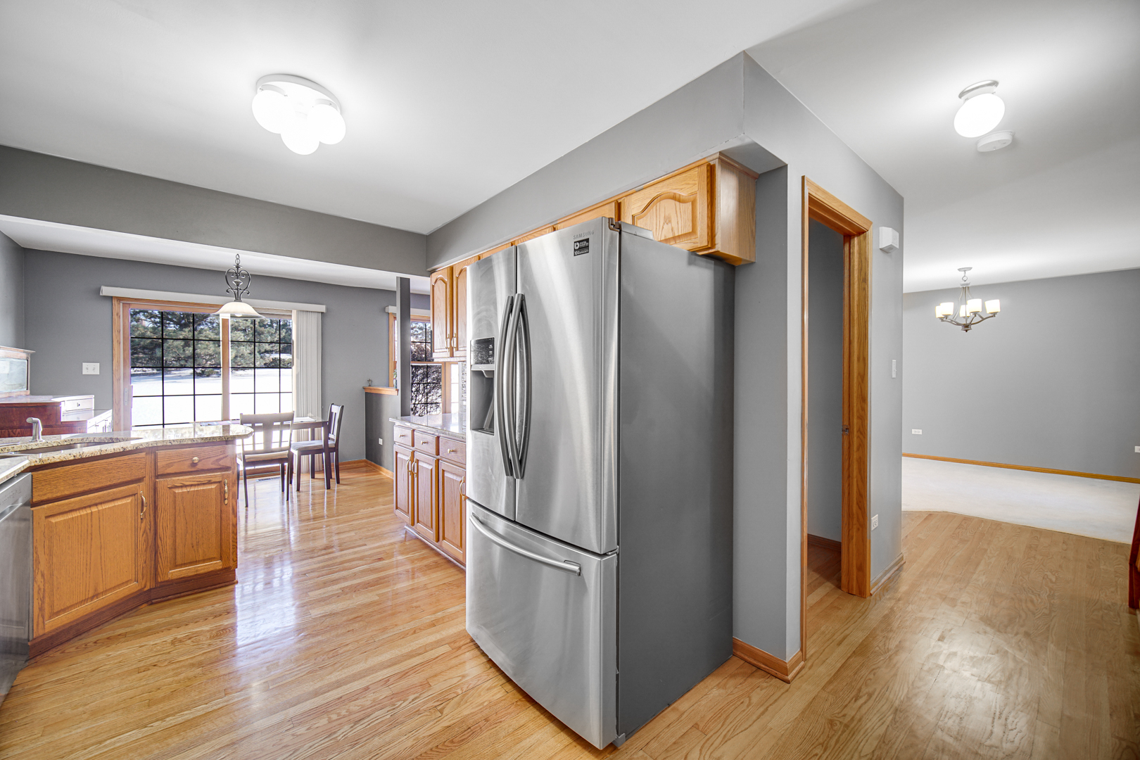11837 Somerset Road Orland Park, IL 60467 - Photo 9 of 26 a kitchen with stainless steel appliances granite countertop a refrigerator and a stove top oven