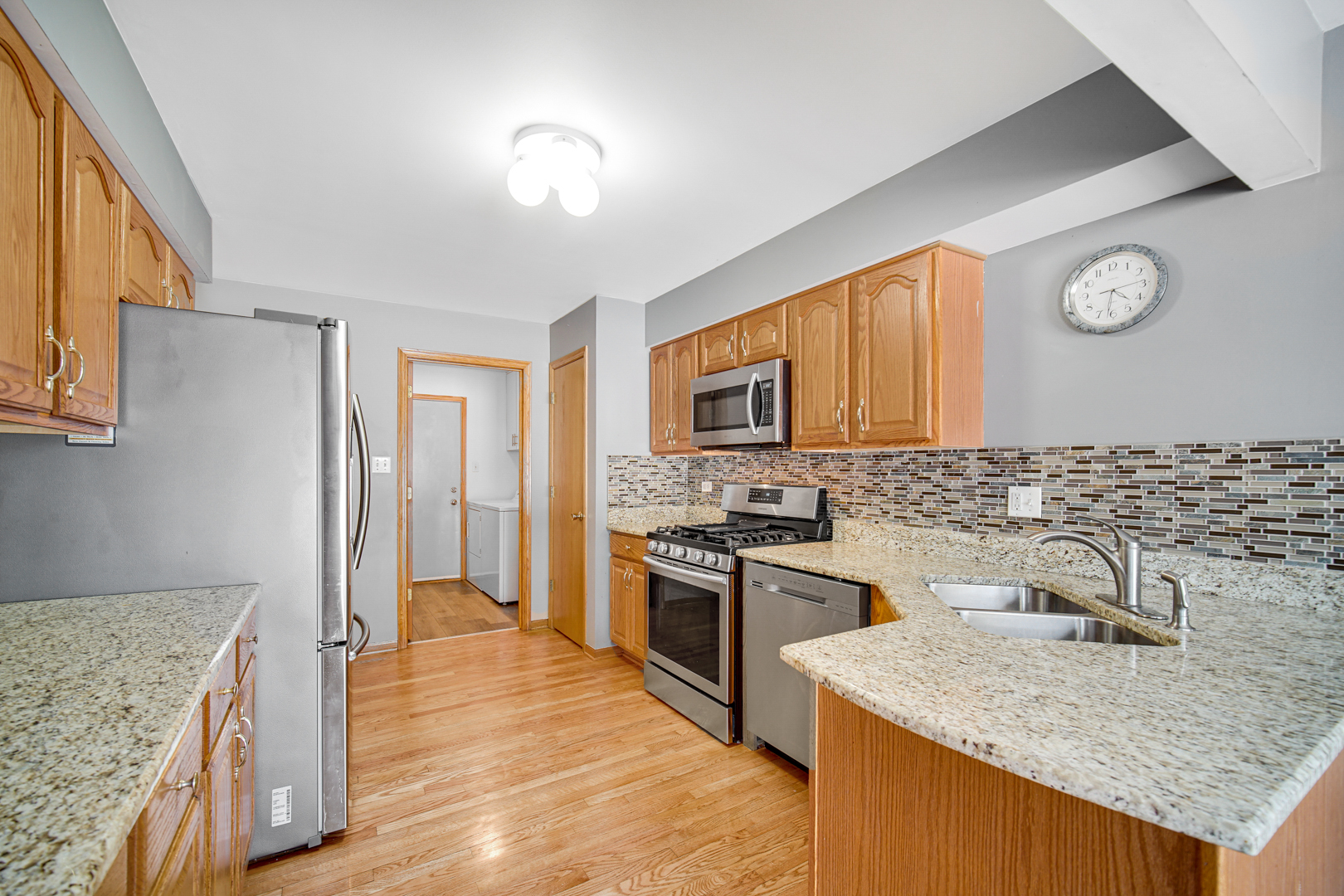 11837 Somerset Road Orland Park, IL 60467 - Photo 10 of 26 a kitchen with a sink stove and refrigerator